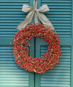 Orange Berry Wreath with Brown Leaves with Bow
